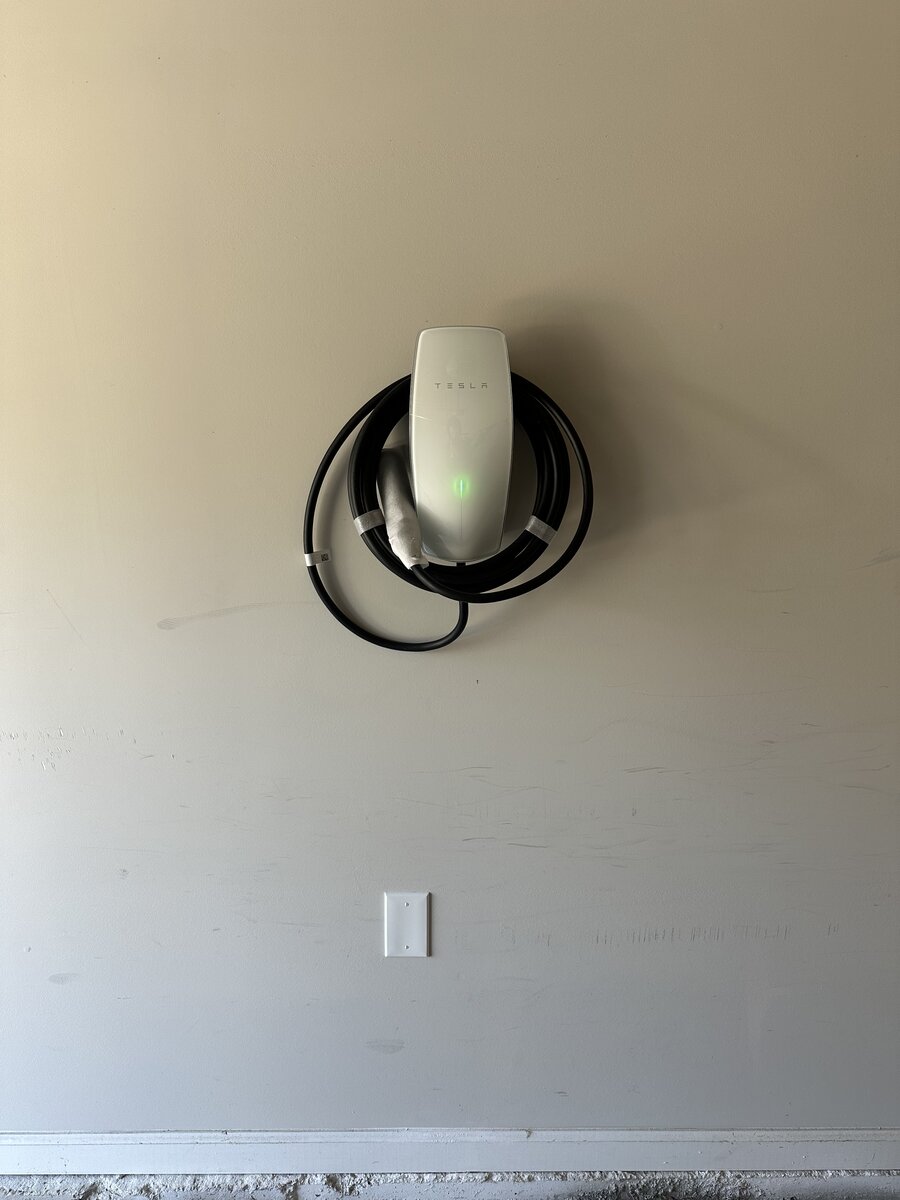 Tesla home charging station with cable management