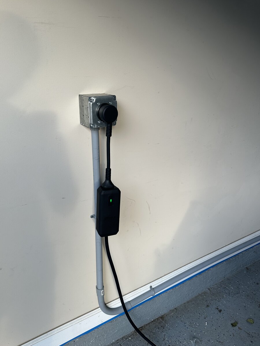 Professional Tesla charger install with clean conduit run