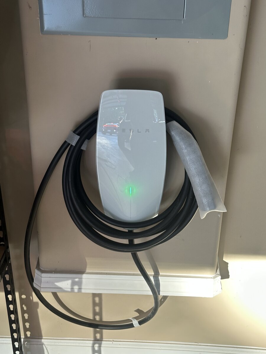 Tesla Wall Connector installation on drywall in garage