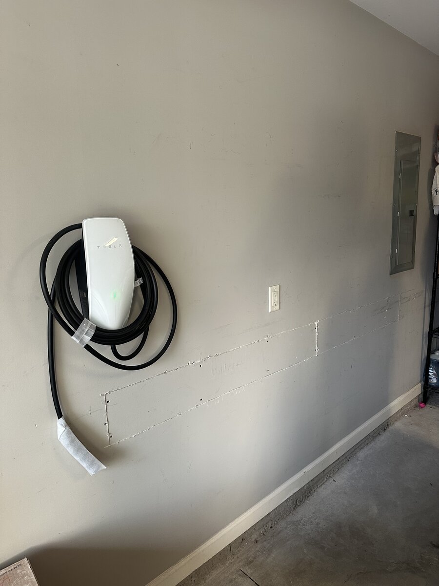 Tesla home charger installation with custom conduit path