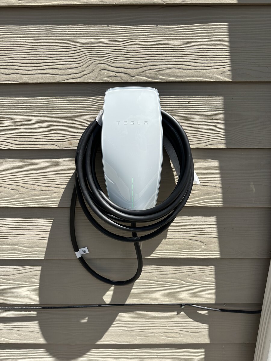 Tesla charger installed in two-car garage bay